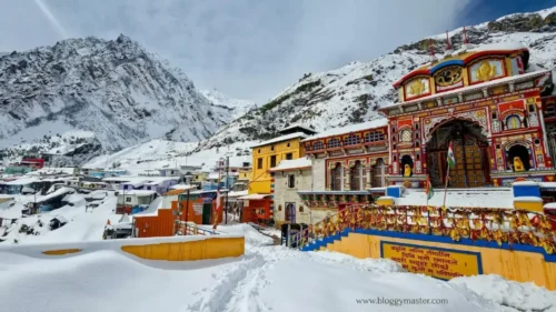 Badrinath Dham Temple in Uttarakhand surrounded by Himalayan mountains during Char Dham Yatra